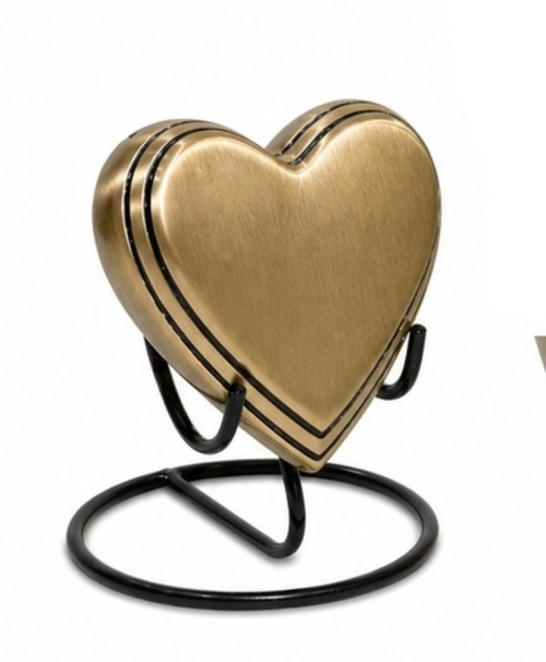 Gouden urn met zwarte accenten