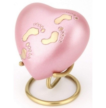 Hartvormige roze urn met gouden voetafdruk