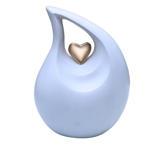 Pastel, lichtblauwe urn met champagnegouden hart